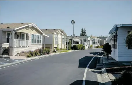  ?? David Butow For The Times ?? A MOBILE home park in Sunnyvale was sold to a private equity firm, and residents worry that rents will rise to levels that might force them to leave. For working folks in California, f lat wages and housing scarcity are at the center of the...