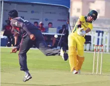  ?? Ahmed Kutty/Gulf News ?? Australia’s D’Arcy Short plays a lofted drive during the Twenty20 match against UAE in Abu Dhabi yesterday.