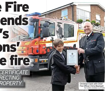  ?? PICTURES: DONNA CLIFFORD ?? Christian Clark with Chief Fire Officer Chris Blacksell