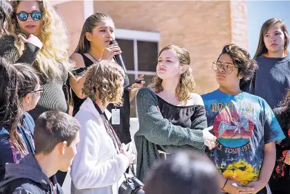  ?? PHOTOS BY NICK SANCHEZ/FOR THE NEW MEXICAN ?? LEFT: Santa Fe High School student Ashleigh Jaramillo shares her concerns about gun violence Thursday as castmates from the school production of 21 Pebbles, a play about the 2012 mass shooting at Sandy Hook Elementary School in Newton, Conn., stand...