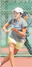  ??  ?? Naho Sato of Japan prepares to return a shot to Switzerlan­d’s Fiona Ganz in the second round of the girl’s singles competitio­n.