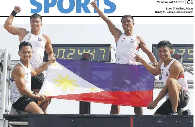  ?? ?? Ahgie Radam, Elias Tabac, Jose Marie de Castro and Mervin Guarte celebrate their OCR gold win by displaying the Philippine  ag.