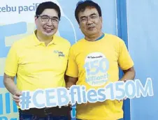  ??  ?? Cebu Pacific’s Lance Gokongwei (left) shares another milestone with Filipinos by awarding its 150 millionth passenger, Alfredo Cruz, with points for a year of travel.