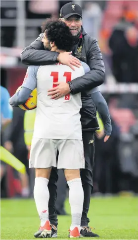  ?? Picture: Mike Hewitt/Getty Images ?? Liverpool manager Jurgen Klopp, hugs hat-trick hero Mohamed Salah afer their 4-0 win over AFC Bournemout­h
