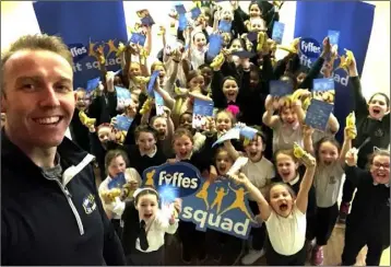  ??  ?? Pupils from St Malachy’s Girls NS enjoy a visit from the Fyffes Fit Squad.