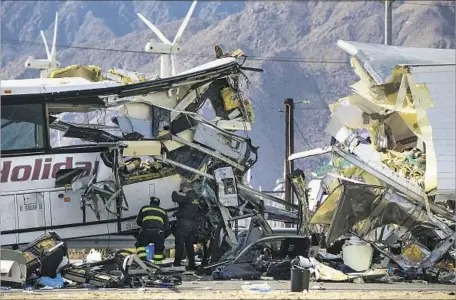  ?? Gina Ferazzi Los Angeles Times ?? A TOUR BUS crashed into the back of a big rig’s trailer just before dawn Sunday on the 10 Freeway in Desert Hot Springs. Damage to the bus suggested it was traveling much faster than the truck, but investigat­ors said it was too early to say whether the...