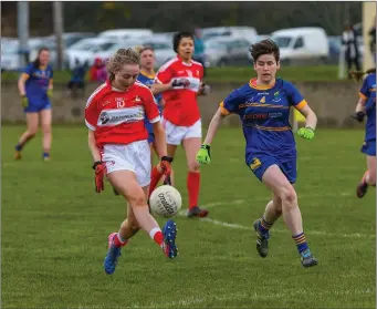  ??  ?? Wicklow’s Aoife Gillen races to tackle Louth’s Aoife Russell in Stabannon on Sunday last.