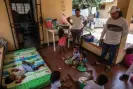  ?? ?? Yeiris Joño, left, mother of four and partner of the Wiwa leader Luis Angel Mejía, right. She looks after 12 children daily in the Indigenous centre in Riohacha where they have taken refuge