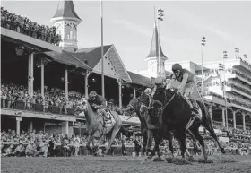  ?? Associated Press file photo ?? Coverage of the 148th Kentucky Derby gets underway today at 1:30 p.m. on NBC. Above, John Velazquez riding Medina Spirit, right, wins last year’s event.