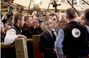  ?? — AP ?? French presidenti­al candidate Francois Fillon (centre) talks to a farmer as he visits the Agricultur­e Fair in Paris on Wednesday.