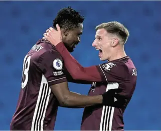  ?? /Reuters ?? A hug for the winner: Leicester City's Daniel Amartey, left, celebrates scoring their winning goal with Marc Albrighton.