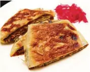  ??  ?? MMZ’s murtabak kambing is ridiculous­ly good.