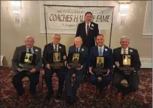  ?? ED MORLOCK — MEDIA NEWS GROUP ?? Montgomery County Coaches Hall of Fame President Dale Hood (standing) poses with 2022induct­ees (left to right) Pat Manzi, Bob Ayton, Bill Zimmerman, Steve Carcarey and Mark Cortese (receiving for Neil Buckley).