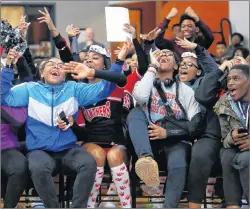  ?? AP PHOTO ?? In this Feb. 16 photo, University Prep Academy High School students react in Detroit to an announceme­nt that all 600 students will see the film “Black Panther.”