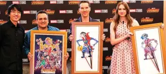  ?? DISNEY FOR JAWA POS ?? INDONESIA BANGET: Dari kiri, Is Yuniarto bersama Joe Russo, Benedict Cumberbatc­h, dan Karen Gillan yang membawa wayang buatannya di Marina Bay Sands Expo &amp; Convention Centre, Singapura, pada Senin (16/4).