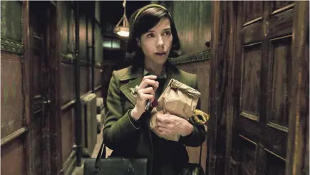  ??  ?? Sally Hawkins, above, stars as a night janitor who finds love in an unlikely place in “The Shape of Water.”