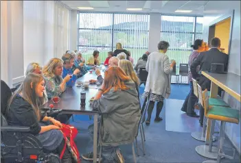  ?? 01_B18choir01 ?? Choir members quench their parched throats during the sociable tea and coffee break.