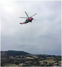  ??  ?? Rescue 17 airlifts the mountain biker to safety