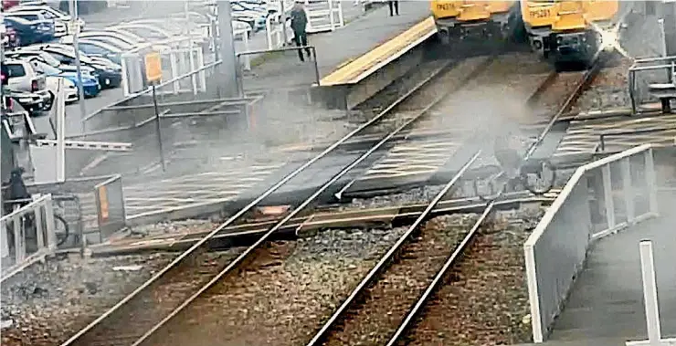  ??  ?? CCTV footage captures a child riding their bike in front of a train at a level crossing in Tawa last month.