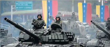  ?? Picture: AFP ?? BOLD DISPLAY: A column of T-72B tanks during a military parade, roll past government buildings during celebratio­ns marking Venezuela's 206th anniversar­y of Independen­ce in Caracas on Wednesday, when dozens of pro-government activists stormed the...