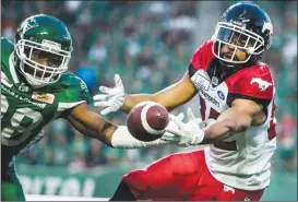  ?? Canadian Press photo ?? Calgary Stampeders wide receiver Juwan Brescacin reaches for a pass during second half CFL action against the Saskatchew­an Roughrider­s, in Regina on Sunday.