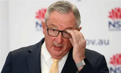  ?? Photograph: Dan Himbrechts/AAP ?? NSW health minister Brad Hazzard at a press conference on Tuesday. He said police are investigat­ing a man’s movements in Byron Bay after he travelled from Sydney. NSW reported a record 356 new local Covid cases overnight.