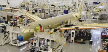  ?? — Reuters ?? Bombardier’s C Series aircrafts are assembled in their plant in Mirabel, Quebec.