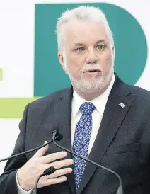  ?? GRAHAM HUGHES/THE CANADIAN PRESS ?? Premier Philippe Couillard announces details of the light-rail system for the Montreal region.