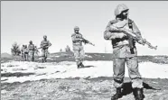  ??  ?? Pakistani soldiers on patrol near the North Waziristan town of Pash Ziarat on March 8, 2011 (AFP)