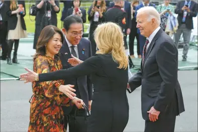  ?? AP photo ?? President Joe Biden (far right), and first lady Jill Biden greeting Japanese Prime Minister Fumio Kishida (second from the left), and his wife Yuko Kishida (far left), upon their arrival at the White House on Tuesday, in Washington.