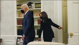  ?? ANDREW HARNIK — THE ASSOCIATED PRESS ?? President Joe Biden and Vice President Kamala Harris arrive at the Oval Office of the White House in Washington on Thursday.