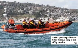  ?? RNLI ?? > The Lyme Regis lifeboat helped rescue people cut off by the tide