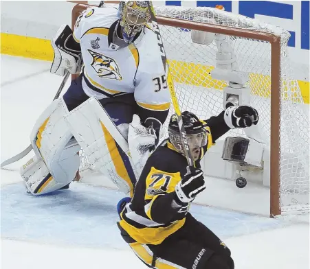  ?? AP PHOTO ?? CRUISE CONTROL: Evgeni Malkin celebrates after beating Predators goalie Pekka Rinne for one of the Penguins’ three goals early in the third period of last night’s 4-1 victory in Game 2 of the Stanley Cup finals in Pittsburgh.