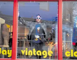  ?? ?? Modelling a unique look in the window of the shop on the Old High Street