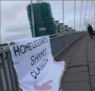  ??  ?? Banners appeared across the city, at spots including the Clyde Arc, and below, the City Chambers