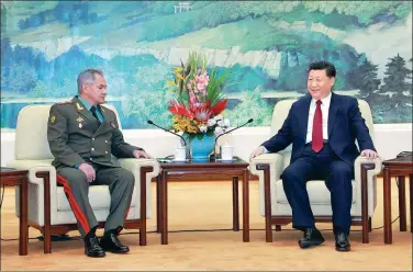  ?? LI GANG / XINHUA ?? President Xi Jinping meets with Russian Defense Minister Sergey Shoygu on Friday in the Great Hall of the People in Beijing.