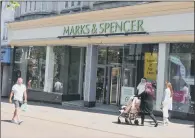  ?? PICTURES: PA WIRE. ?? TROUBLES AHEADR: Hundreds of jobs are due to be lost as Marks & Spencer closes store in a drive to cuts costs.