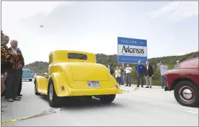  ?? NWA Democrat-Gazette/Charlie Kaijo ?? Classic cars and pickups enter the new Interstate 49 Bella Vista Bypass on Thursday near Hiwasse.