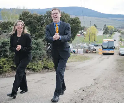  ?? DARRYL DYCK/THE CANADIAN PRESS/FILES ?? Agricultur­e Minister Lana Popham, pictured with former B.C. NDP Leader Adrian Dix, right, is at the heart of a situation involving fish farming, provincial lab research, the department of fisheries and oceans, and First Nations.