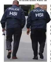  ?? DAVID SWANSON/AGENCE FRANCE-PRESSE ?? HOMELAND Security Investigat­ions agents walk outside the home of United States producer and musician Sean ‘Diddy’ Combs in Los Angeles, California as the hip hop mogul is accused of sex traffickin­g and sex assault.