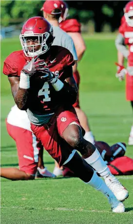  ?? [PHOTO BY STEVE SISNEY, THE OKLAHOMAN] ?? OU freshman Trey Sermon is doing a little bit of everything for the Sooners — even throwing a pass in a trick play against Texas.