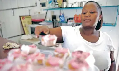  ?? PICTURE: EPA ?? AS THE COOKIE… Small businesswo­man Nonny Mathildset­i’s bakery and cafe could be hit by a VAT increase.
