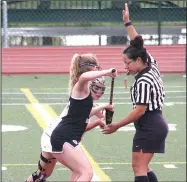  ?? Courtesy photo ?? Lucile Latham (foreground) of Bentonvill­e prepares for a face-off during a lacrosse game against Jenks, Okla., last season.