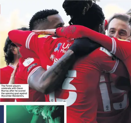  ??  ?? The Forest players celebrate with Glenn Murray after he scored the opening goal against Wycombe Wanderers.