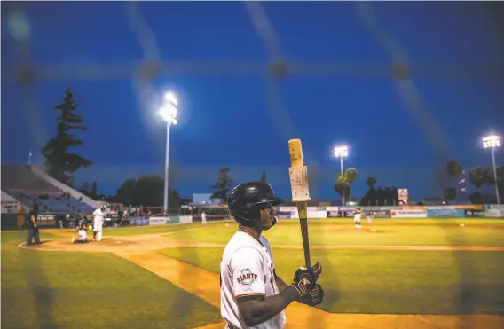  ?? Stephen Lam / The Chronicle ?? San Jose Giants shortstop Marco Luciano stands in the on deck circle during a game against the Modesto Nuts at Excite Ballpark in San Jose in June.