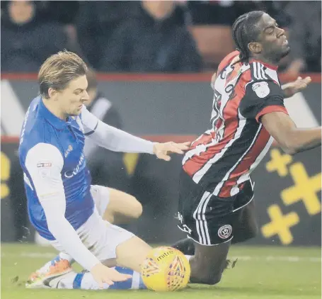  ??  ?? Glenn Loovens makes his presence felt against Sheffield United’s Clayton Donaldson in a Steel City derby last season.