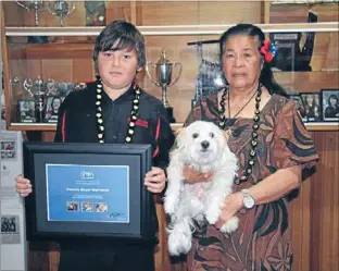  ?? Photo: ANGELINE HUMPHREYS, BRANDON INTERMEDIA­TE ?? Rescuer: Brandon Intermedia­te pupil Damon Boyer-Marwood was given an SPCA bravery award on June 1, at a ceremony attended by Rose, the dog he saved from a beating, and her owner Sosefina Leota.