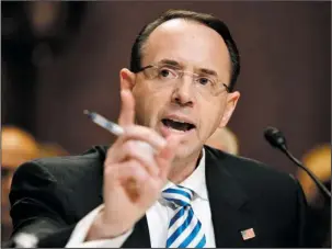  ??  ?? ROSENSTEIN: Deputy Attorney General Rod Rosenstein testifies Tuesday on Capitol Hill in Washington. President Donald Trump confirmed Friday he was under investigat­ion and appeared to take aim at a senior Justice Department official, in a tweet that...