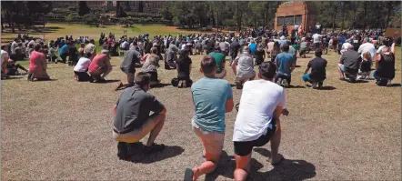  ?? Photo: Nampa/AFP ?? End violence… Farmers kneel as they pray during their protest against farm murders and attacks at the Union Buildings in Pretoria.