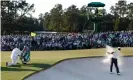  ?? Photograph: Mike Segar/Reuters ?? Hideki Matsuyama plays out from the bunker on to the 18th green at Augusta, to set up the clinching two putts.